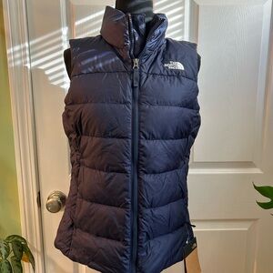Brand new with tags, Navy North Face winter vest, size medium.